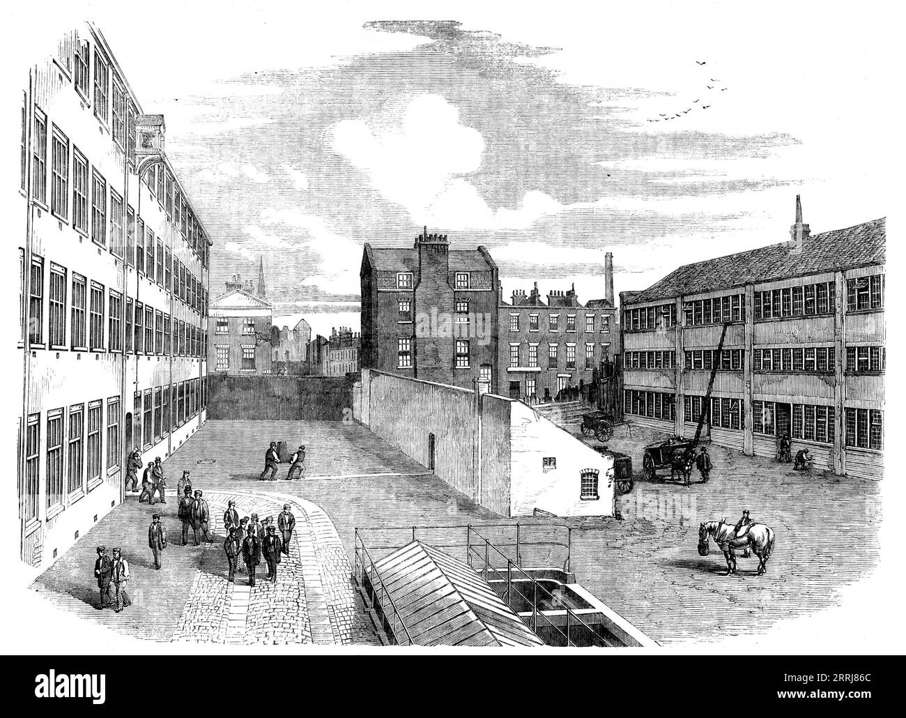 Manufacture de Broadwood's Pianoforte, Horseferry-Road, Westminster, 1858. 'En entrant dans les locaux, la première chose qui frappe est la grande surface qu'ils couvrent... la nouvelle gamme d'ateliers est à gauche... à droite est la seule partie restante de l'ancienne usine qui a échappé à l'incendie. Le nouveau bâtiment mesure 303 pieds 9 pouces de longueur et 46 pieds de largeur. La grande surface à l'intérieur des murs est divisée en trente-deux ateliers, chacun de 70 pieds de long sur 21 pieds de large, avec lesquels la communication est obtenue de l'extérieur par une entrée générale située au centre du bâtiment, formée par un se Banque D'Images