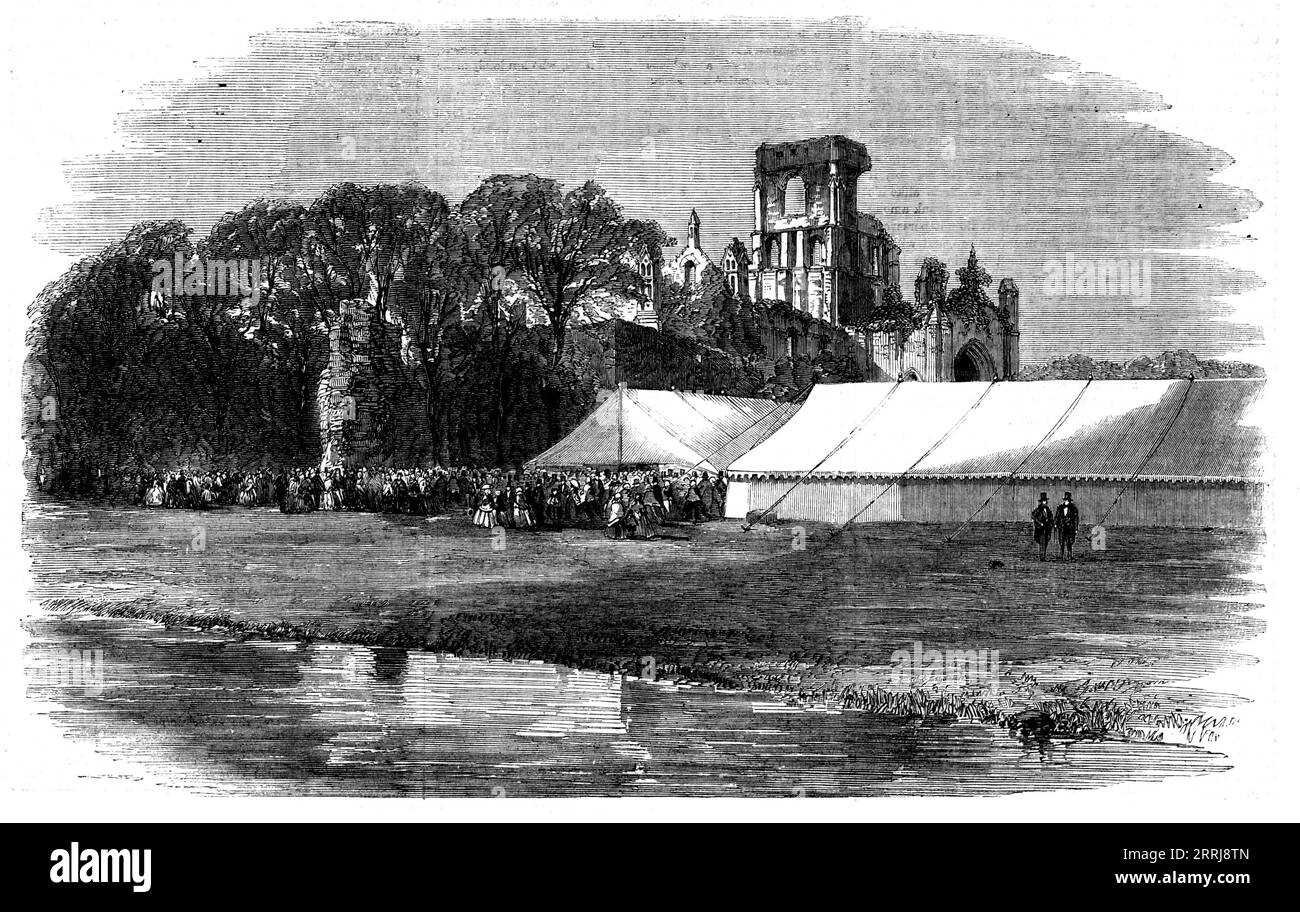 Réunion de la British Association for the Advancement of Science à Leeds - la fête horticole à Kirkstall Abbey, 1858. 'L'endroit est admirablement adapté pour une telle fête, les magnifiques ruines de l'ancienne abbaye donnant un intérêt supplémentaire à l'un des plus beaux paysages à trouver dans le voisinage immédiat, et ce n'était pas surprenant, par conséquent... pour voir réunis dans le parc au cours de l'après-midi une assemblée des plus brillantes et à la mode... les jardins... ont été engloutis avec mesdames et messieurs, appréciant la variété de l'exposition... [qui] était répartie sur deux commodes ma Banque D'Images