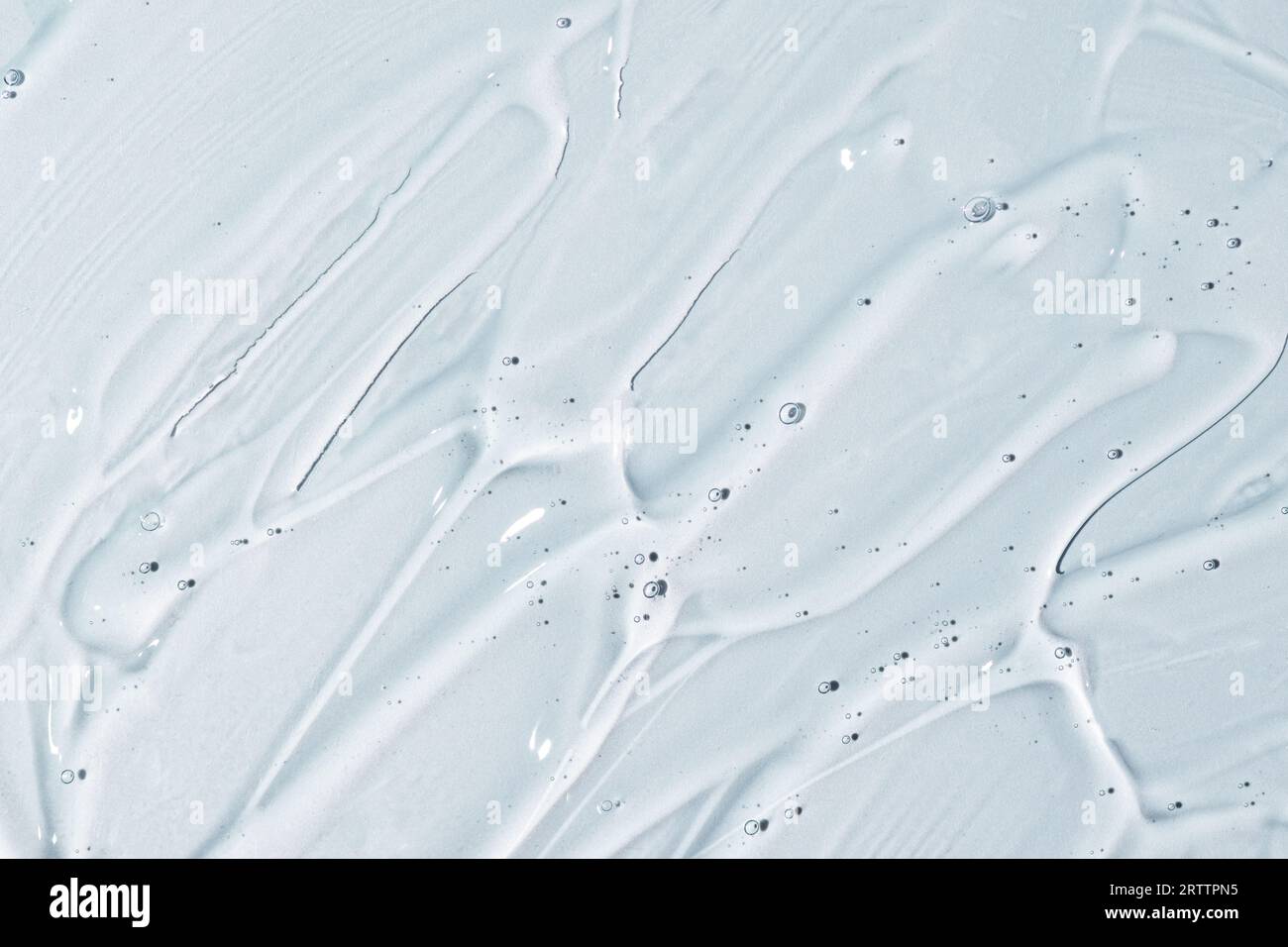 Texture du sérum visage. Fond abstrait de gel transparent hydratant. Banque D'Images