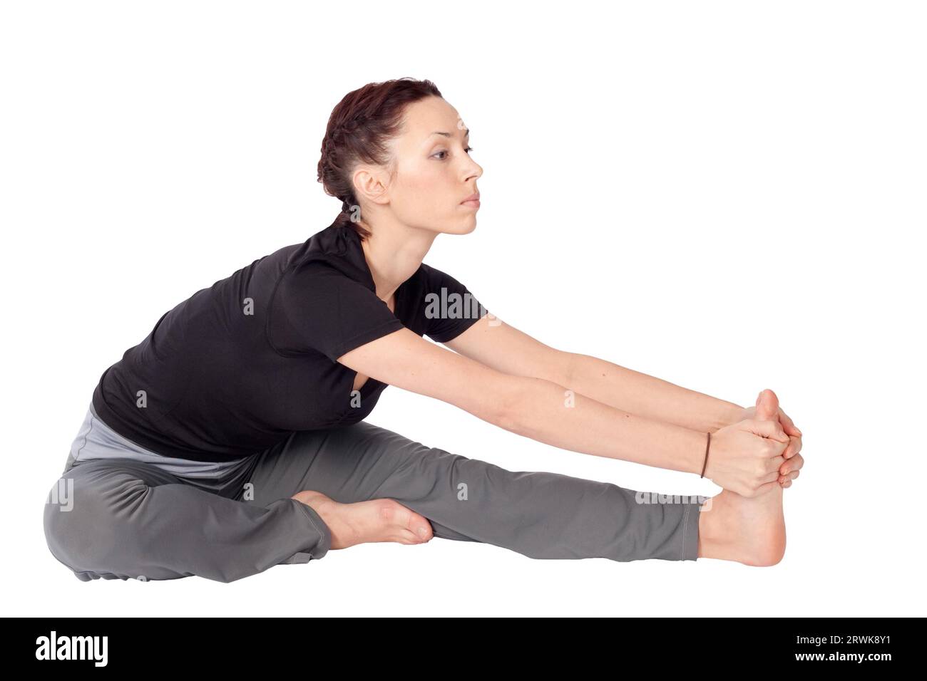 Jeune femme en forme faisant des exercices d'étirement, isolé sur fond blanc Banque D'Images