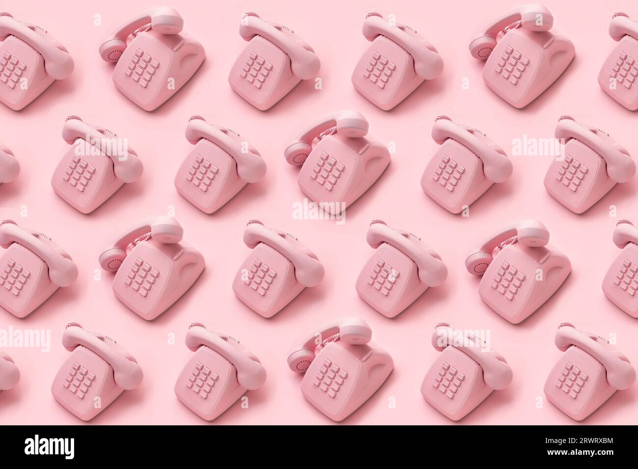 Motif de téléphone à cadran rotatif vintage sur fond rose. Concept créatif, centre d'appels, support client. . Photo de haute qualité Banque D'Images