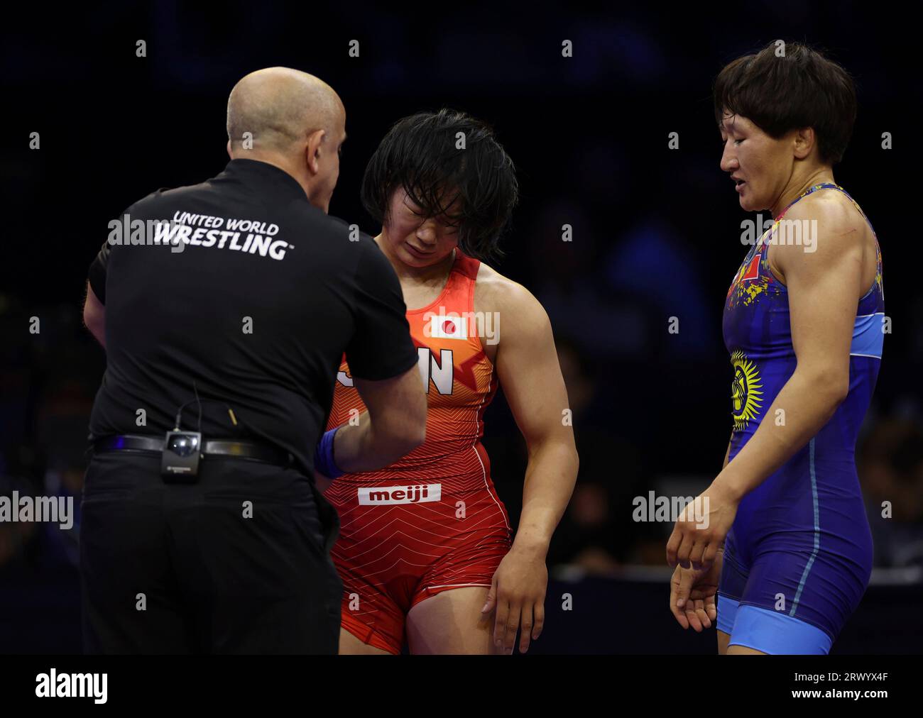 Aisuluu TYNYBEKOVA of Kyrgyz(blue) and Sakura MOTOKI of Japan after