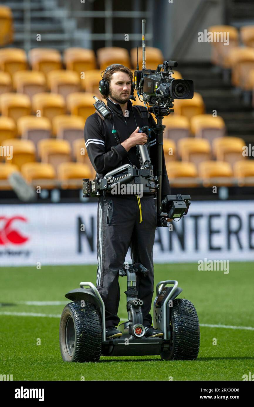 Caméraman de télévision sur un Segway couvrant un événement sportif Banque D'Images