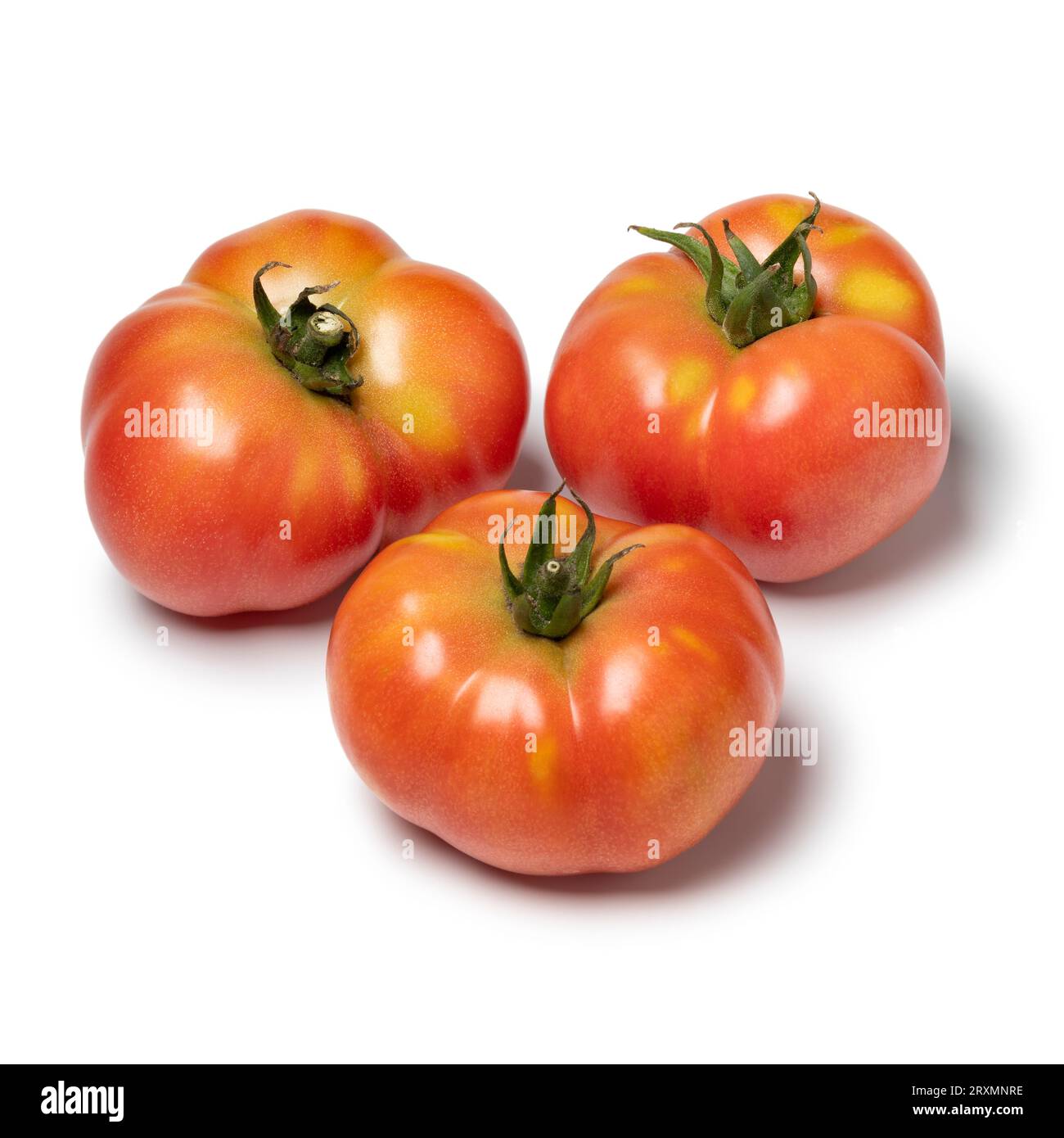 Trois tomates Galapagos entières isolées sur fond blanc en gros plan Banque D'Images