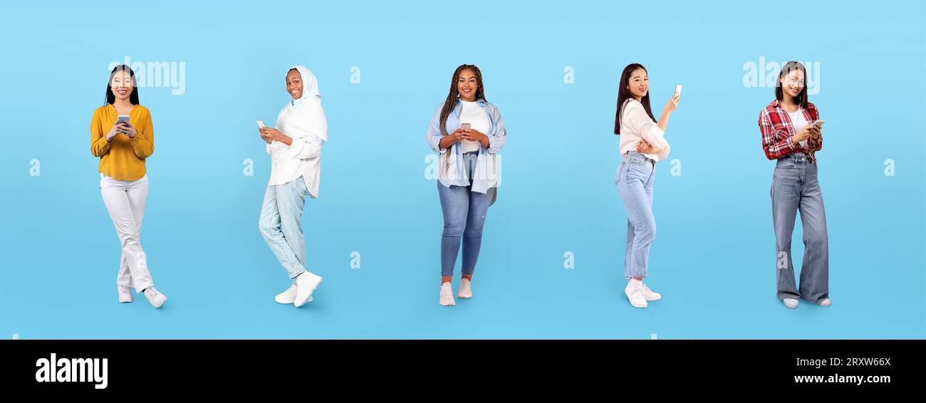 Joyeux jeunes femmes noires, arabes, asiatiques dans le chat occasionnel sur smartphones Banque D'Images