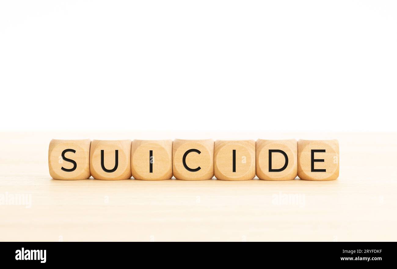 Concept de suicide.Mot sur bloc de bois.Copier l'espace.Arrière-plan blanc Banque D'Images