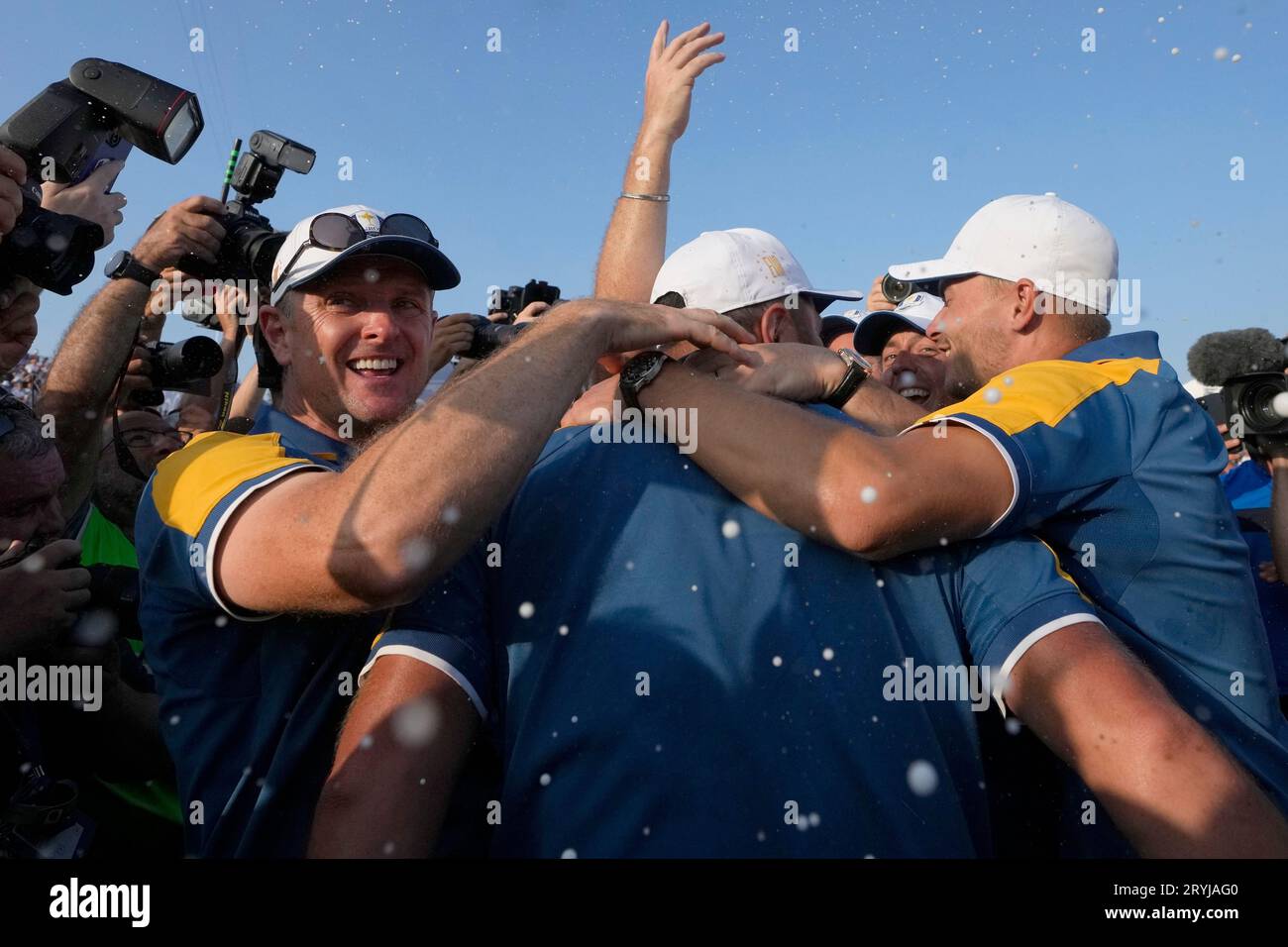 Europe's Justin Rose, left , Europe's Rory McIlroy second left and Europe's Nicolai Hojgaard, celebrate together after Europe won the Ryder Cup after th end of the singles matches at Ryder Cup golf tournament at the Marco Simone Golf Club in Guidonia Montecelio, Italy, Sunday, Oct. 1, 2023. (AP Photo/Gregorio Borgia ) Banque D'Images