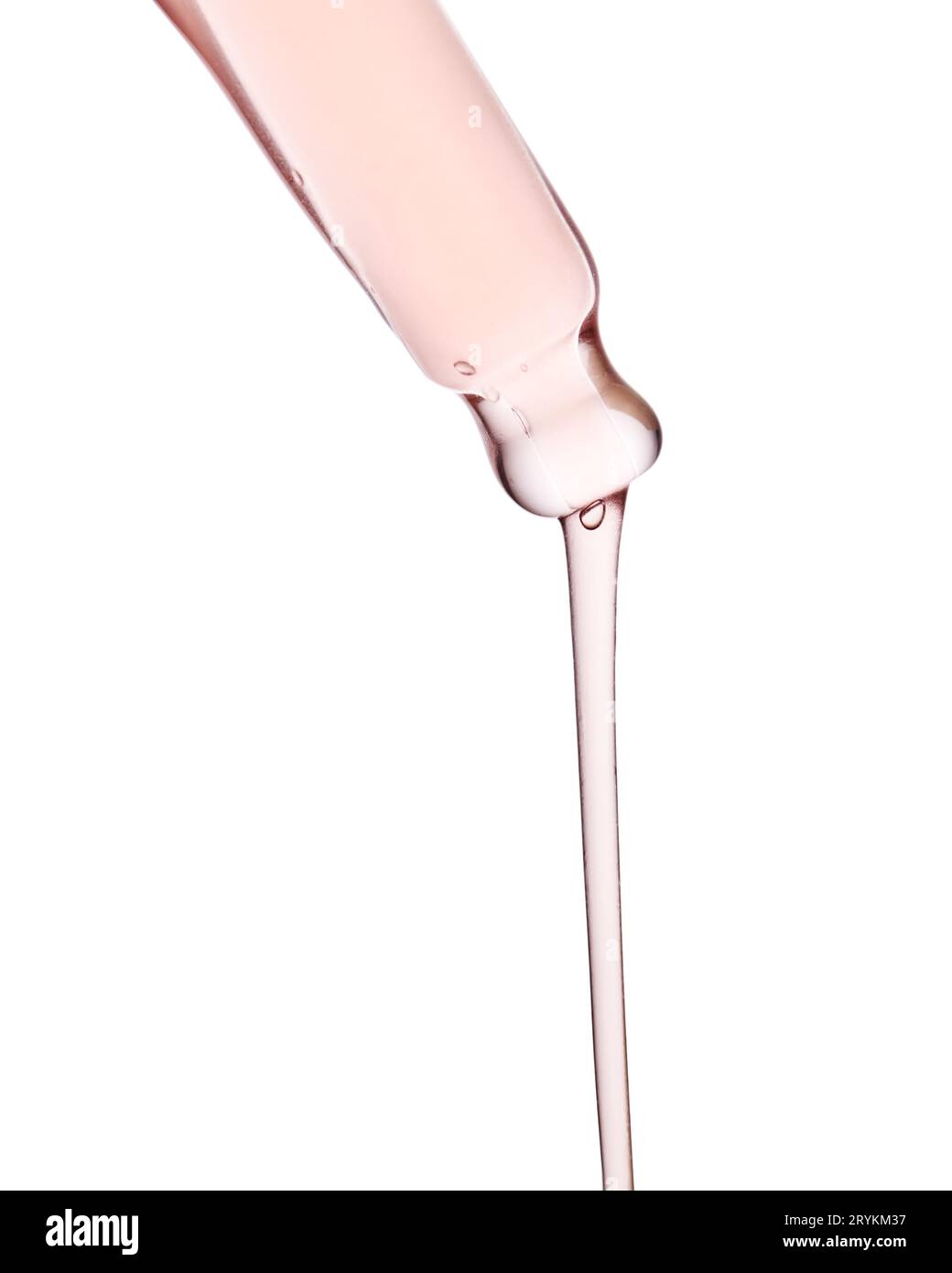 Pipette avec un gros plan cosmétique rose visqueux. Banque D'Images