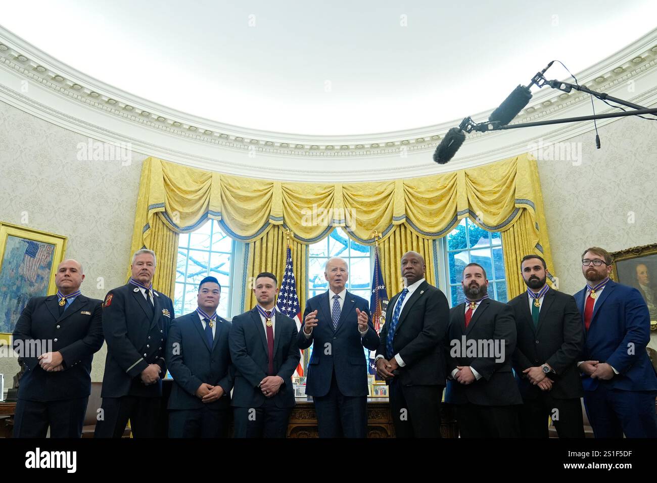 President Joe Biden, center, poses for a photo with Medal of Valor ...