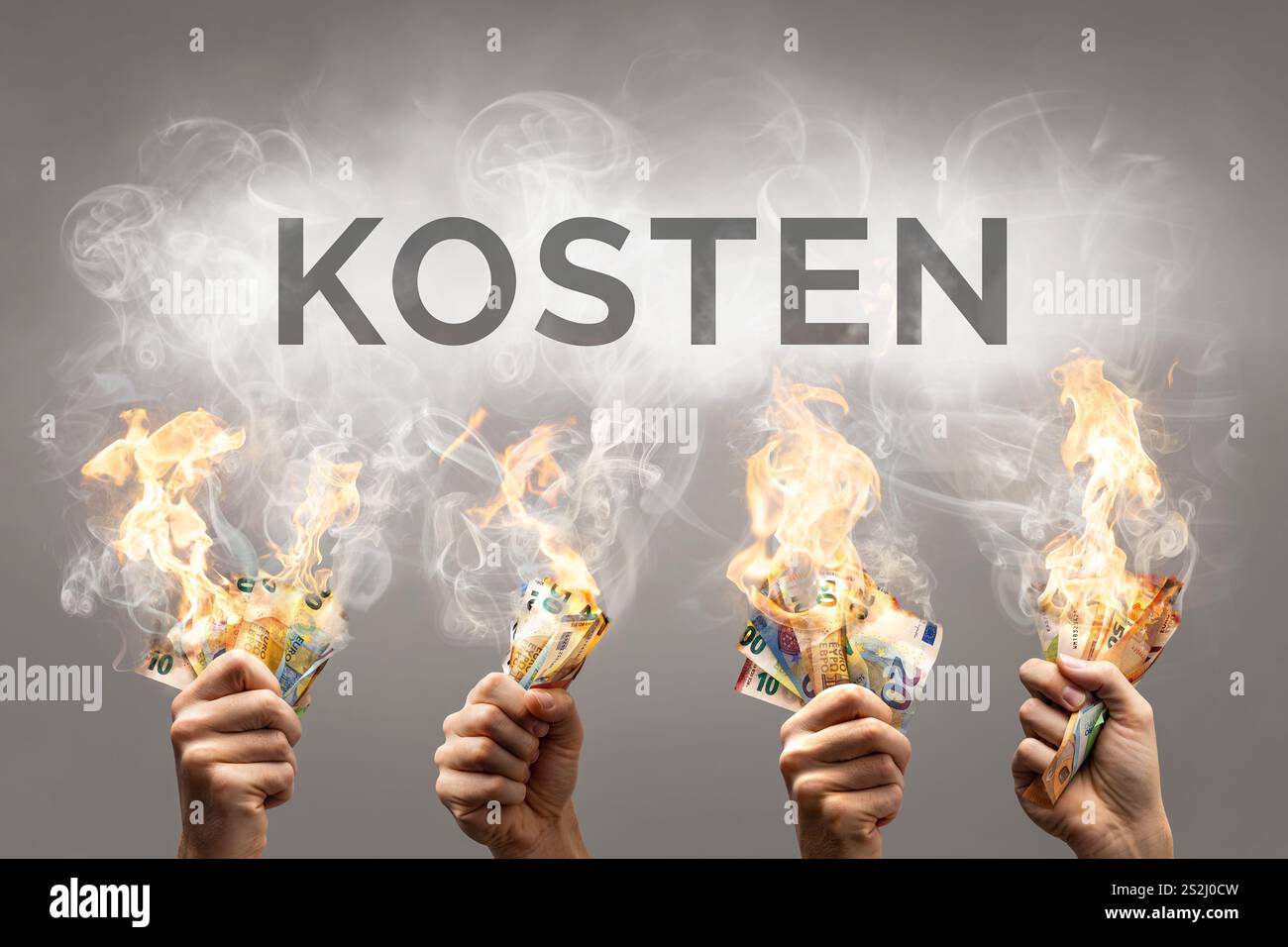 Brûler des billets en euros avec le mot allemand 'Kosten' (anglais : 'cost') affiché ci-dessus Banque D'Images