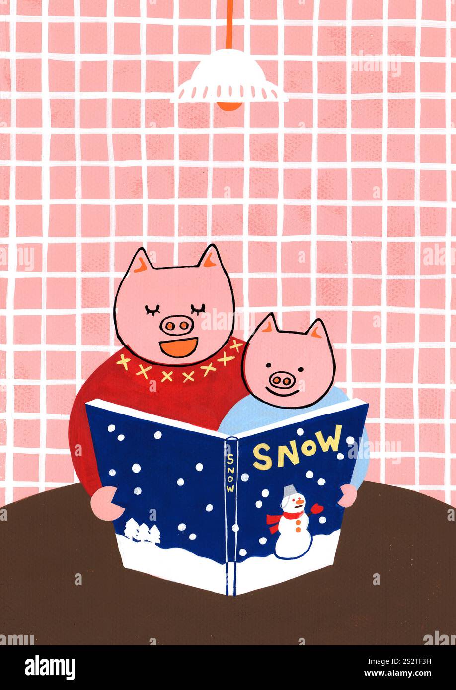 Parent et enfant lisant un livre d'images Banque D'Images