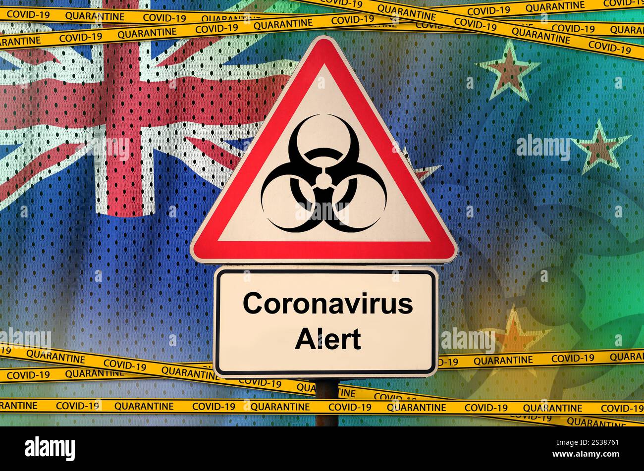 Drapeau néo-zélandais et symbole de danger biologique COVID-19 avec ruban orange de quarantaine. Concept de coronavirus ou virus pandémique 2019-nCoV. Drapeau néo-zélandais et Banque D'Images