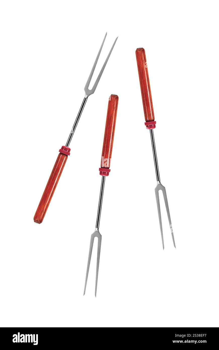 Grandes fourchettes avec poignée en bois sur un blanc. Grandes fourchettes avec manche en bois Banque D'Images