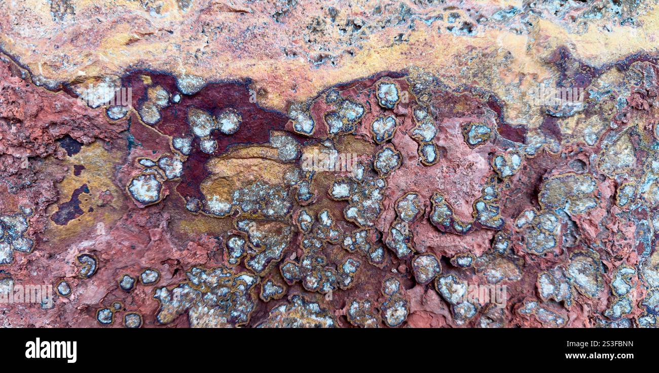 Macro de texture Red Rock Stone. Panoramique, gros plan. Banque D'Images
