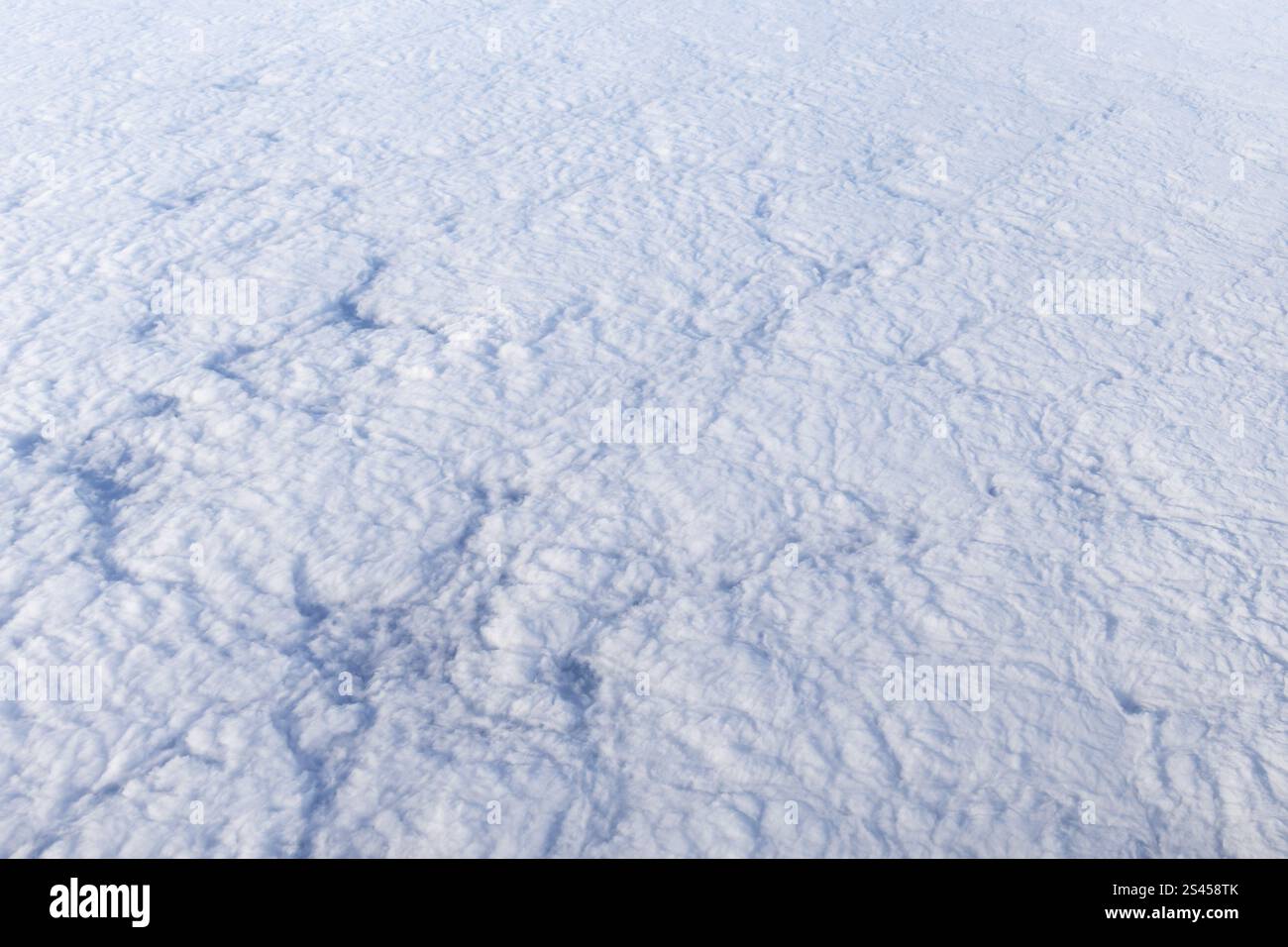 arrière-plan montrant la texture des nuages vus d'en haut, pris depuis une fenêtre d'avion Banque D'Images