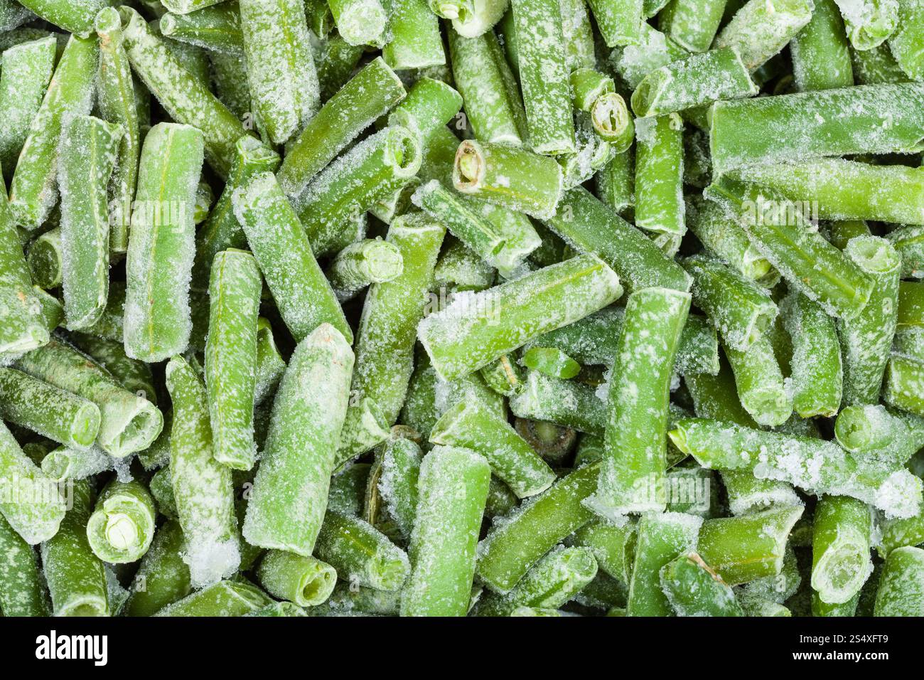 Arrière-plan de l'alimentation - beaucoup de couper les haricots congelés close up Banque D'Images