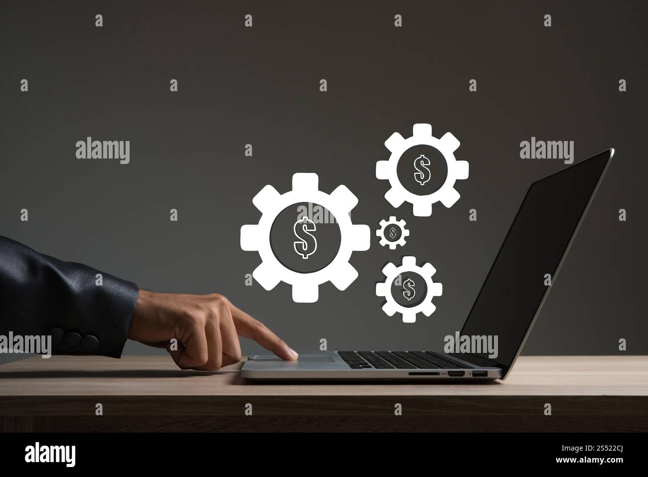 Businessman touching sur ordinateur portable avec roue de réglage. Banque D'Images