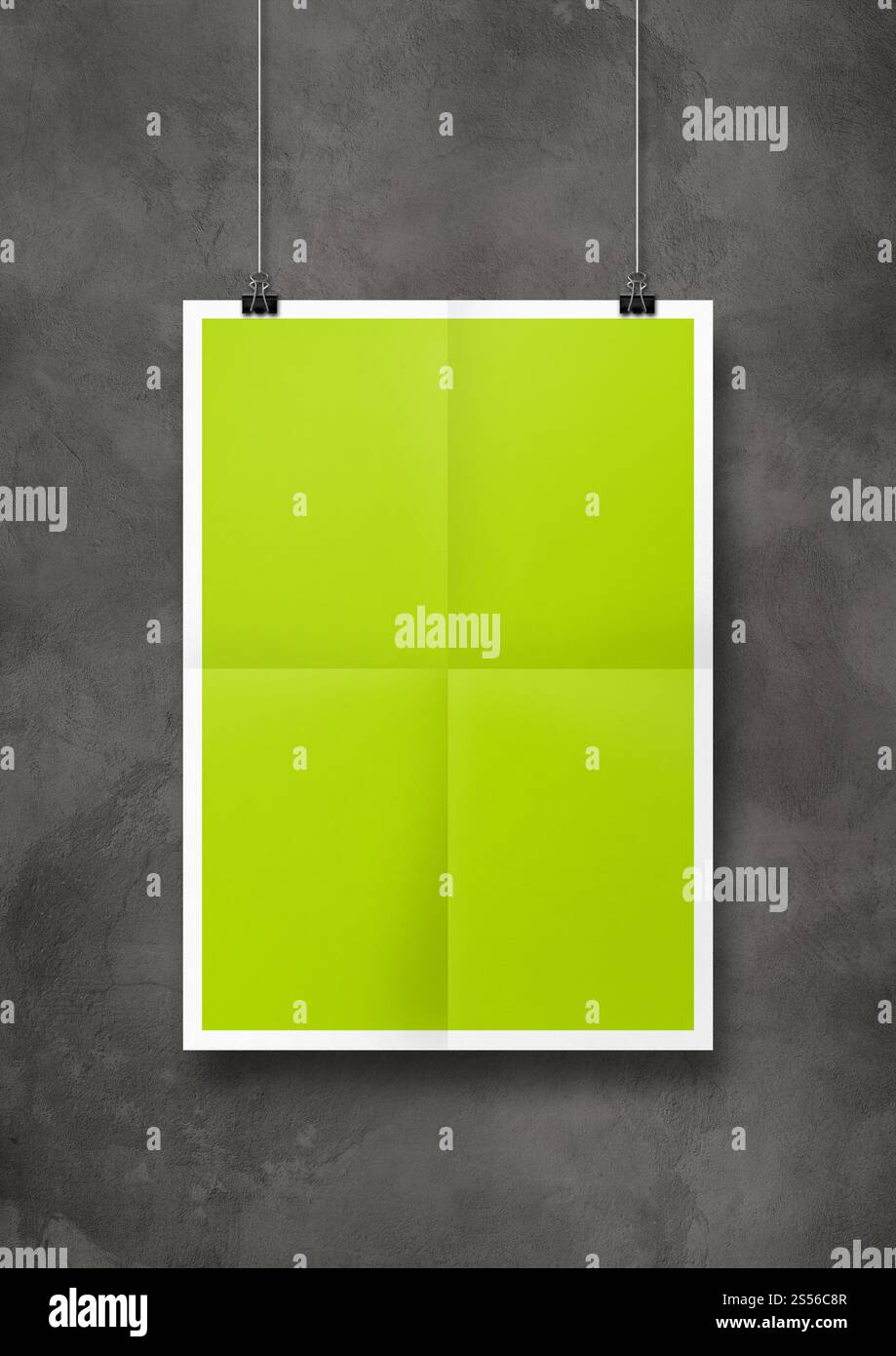 Affiche pliée vert lime accrochée sur un mur en béton avec des clips. Modèle de maquette vierge. Affiche pliée vert lime accrochée sur un mur en béton avec des clips Banque D'Images