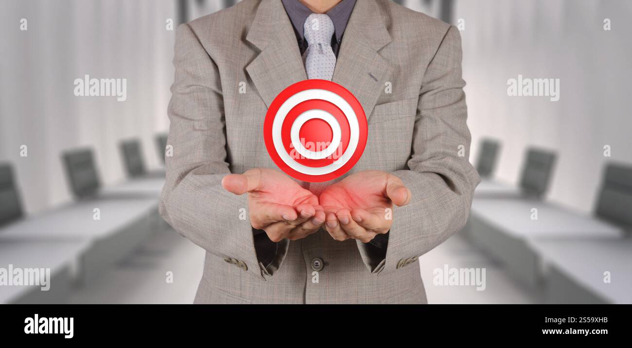 Businessman main montre le symbole du concept d'entreprise comme cible Banque D'Images