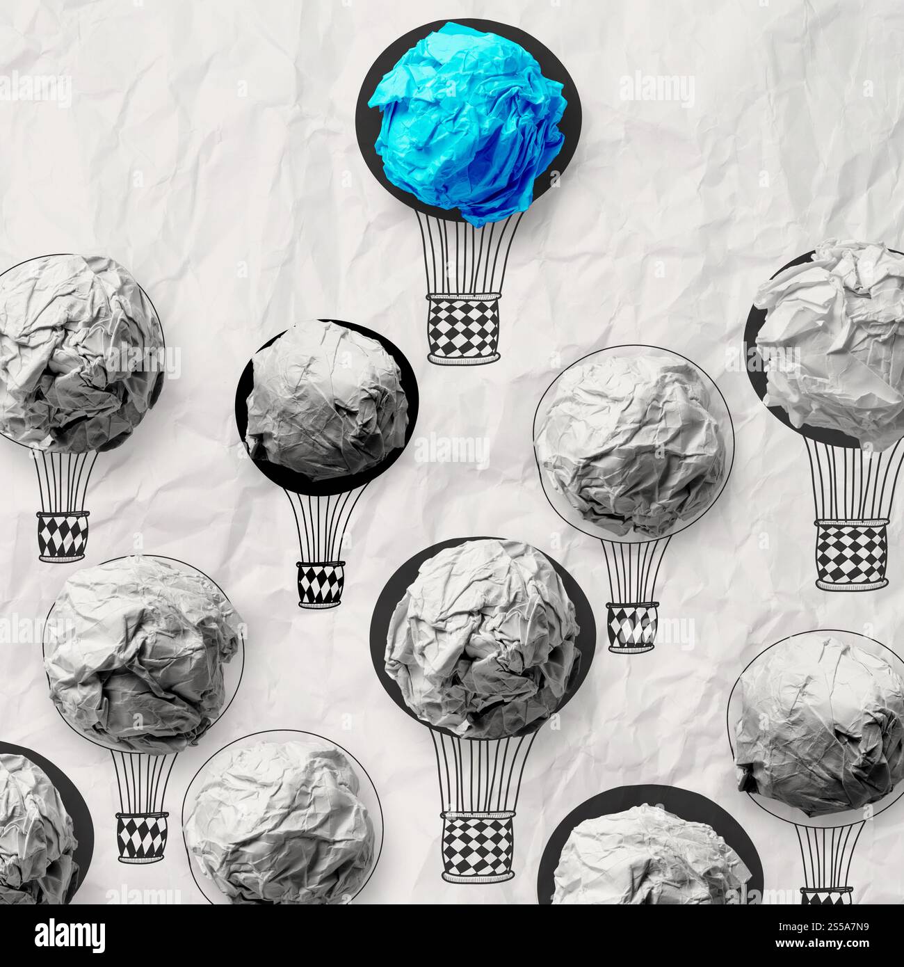 Part de l'air ballons avec boule de papier froissé comme concept de leadership Banque D'Images
