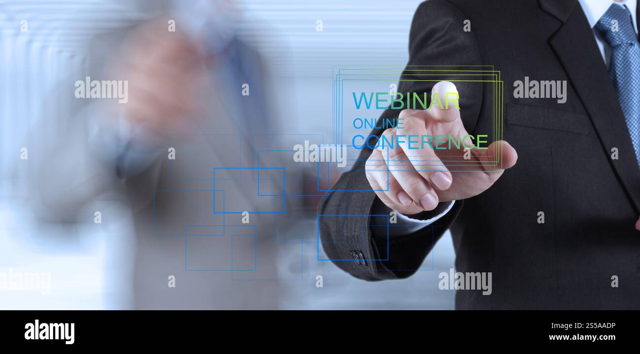 Businessman hand afficher en ligne webinaire conférence en tant que concept Banque D'Images