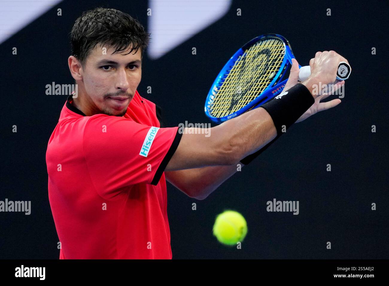 Alexei Popyrin of Australia plays a backhand return to Corentin Moutet of France during their first round match at the Australian Open tennis championship in Melbourne, Australia, Tuesday, Jan. 14, 2025. (AP Photo/Vincent Thian) Banque D'Images