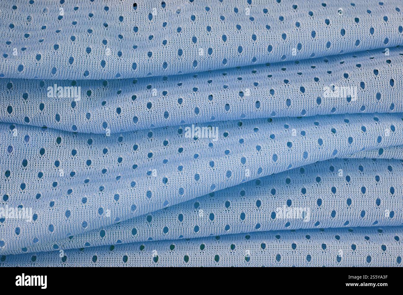 Fond de modèle textile de tissu de tissu de sport de maille bleu. Couleur bleue maillot de football vêtements tissu texture vêtements de sport. Porifère poreux respirant Banque D'Images