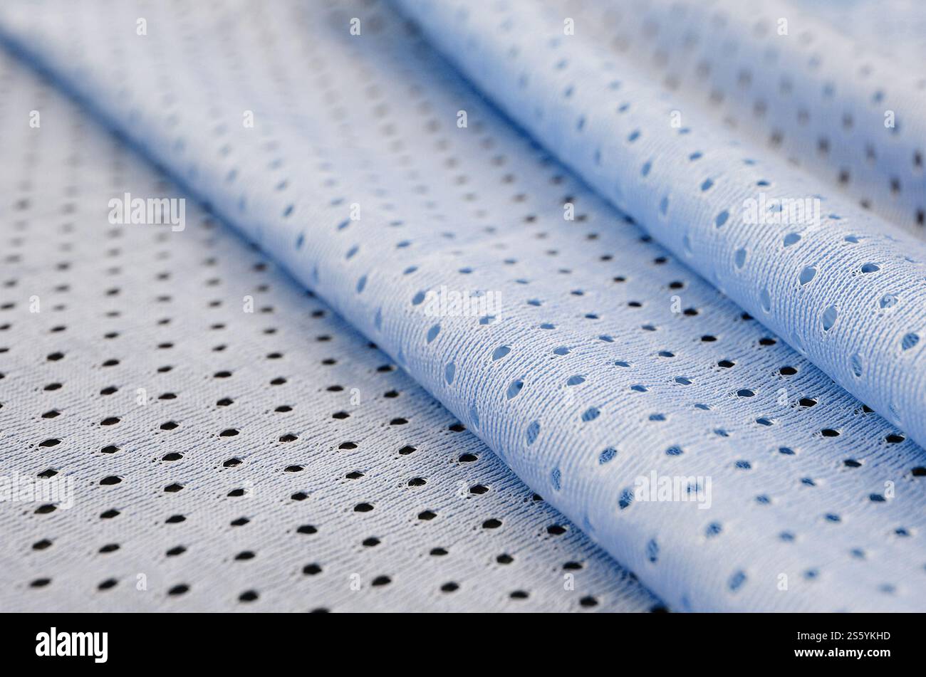 Fond de modèle textile de tissu de tissu de sport de maille bleu. Couleur bleue maillot de football vêtements tissu texture vêtements de sport. Porifère poreux respirant Banque D'Images