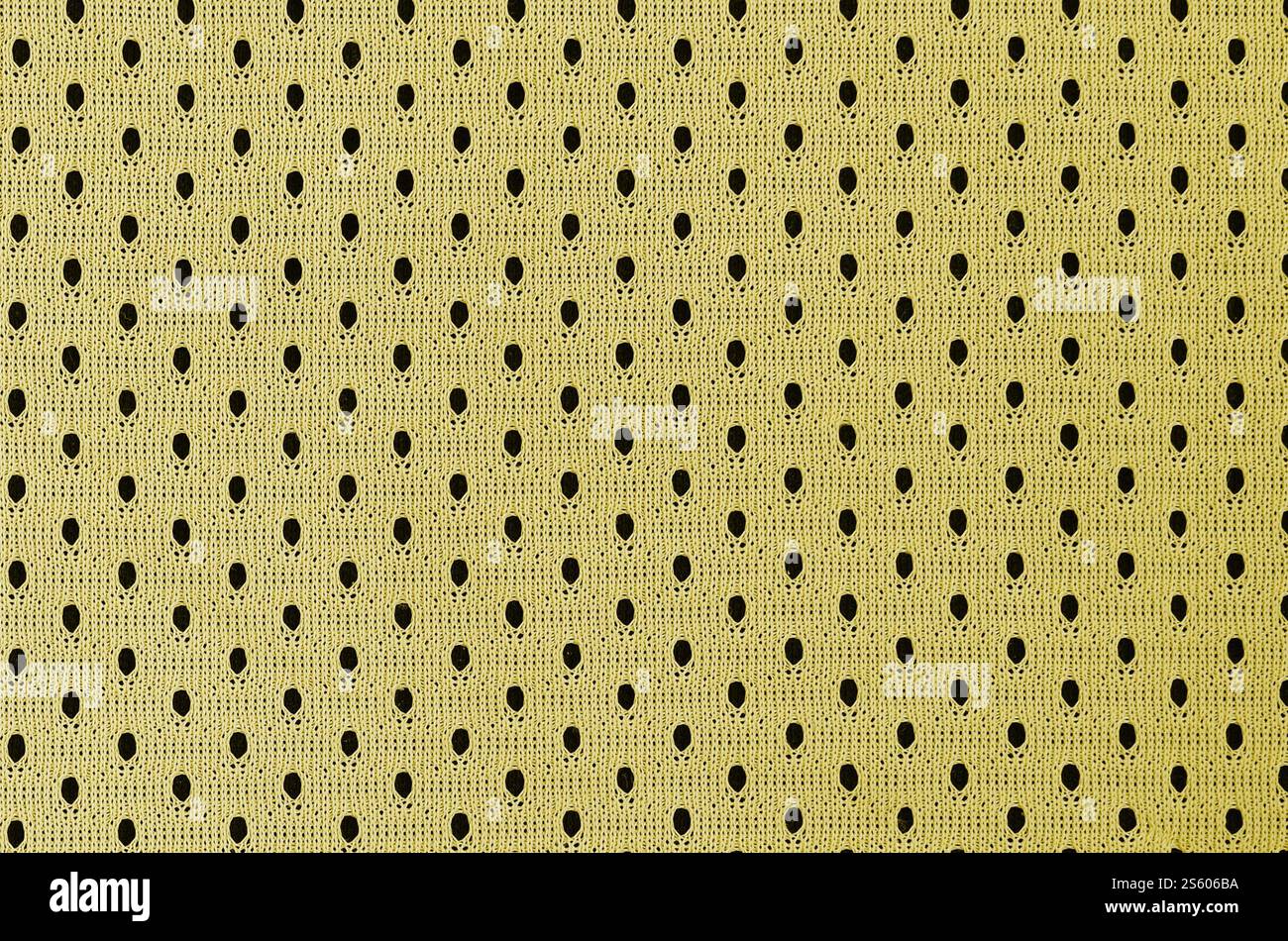Fond de modèle textile de tissu de tissu de sport de maille jaune. Couleur jaune maillot de football vêtements tissu texture vêtements de sport. Poreux respirant Banque D'Images