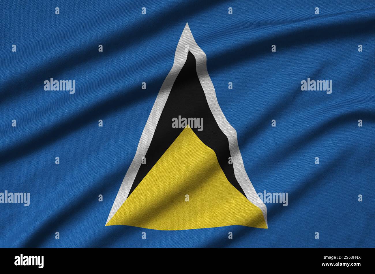 Le drapeau de Sainte-Lucie est représenté sur un tissu de sport avec de nombreux plis. Bannière agitant l'équipe sportive. Le drapeau de Sainte-Lucie est représenté sur un tissu de sport Banque D'Images