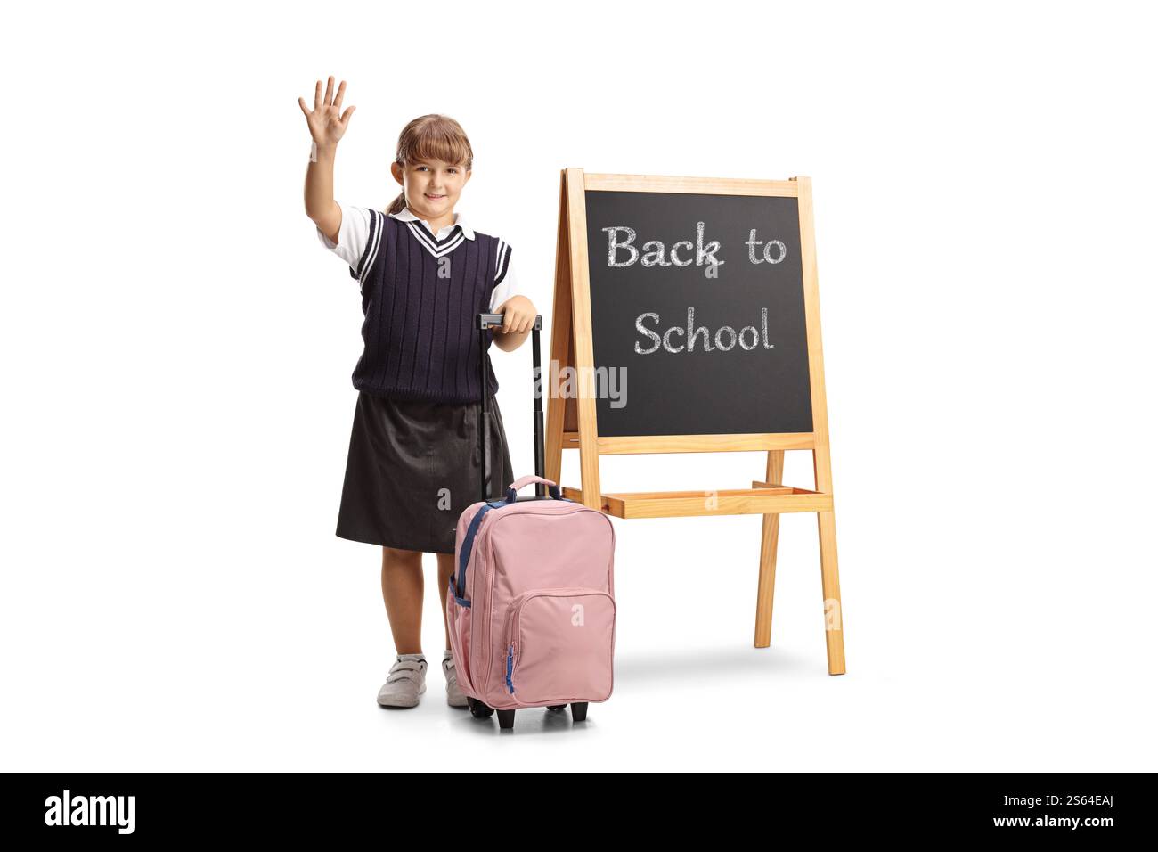 Bonne écolière avec un cartable de retour à l'école isolé sur fond blanc Banque D'Images