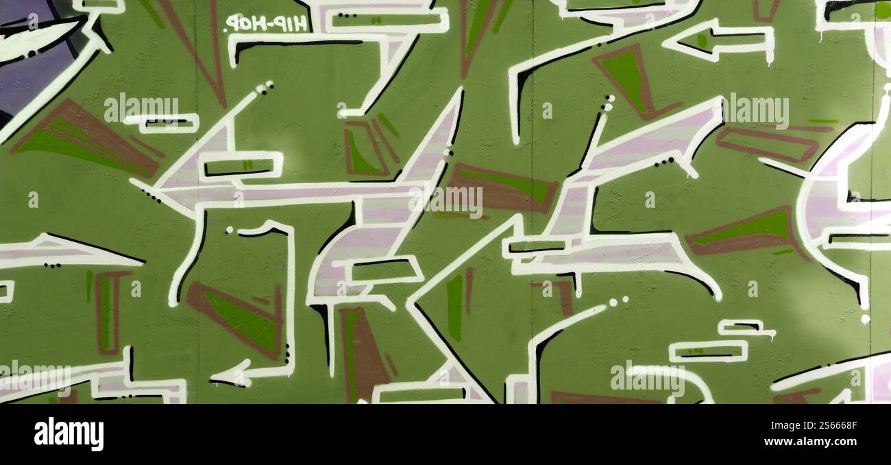 Fond coloré de graffiti peinture d'art avec des bandes d'aérosol brillantes sur le mur en métal. Pièce d'art de rue Old School faite avec de la peinture en aérosol Banque D'Images