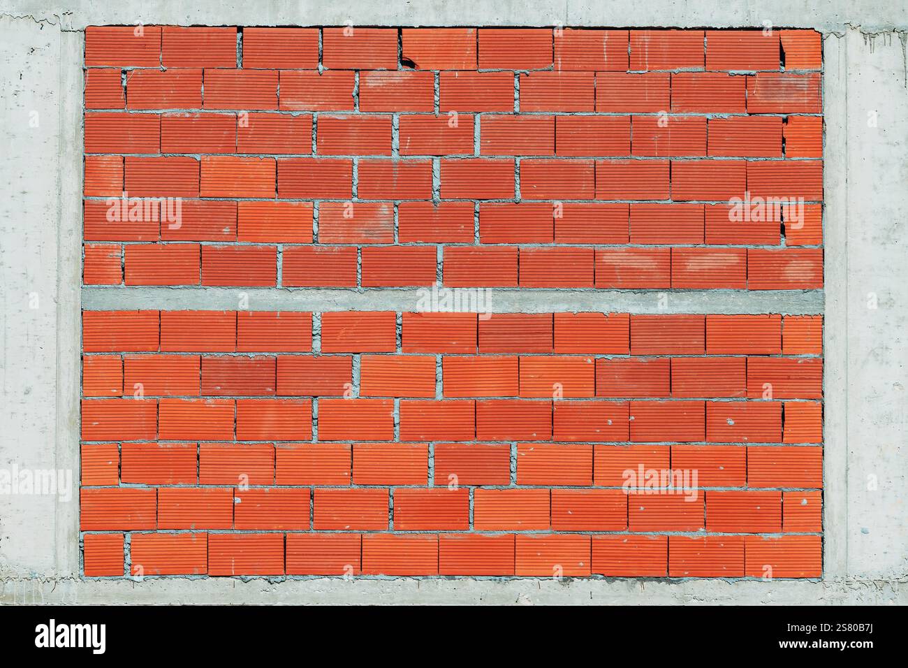 Mur de bâtiment fait de cadre en béton et blocs d'argile comme fond Banque D'Images