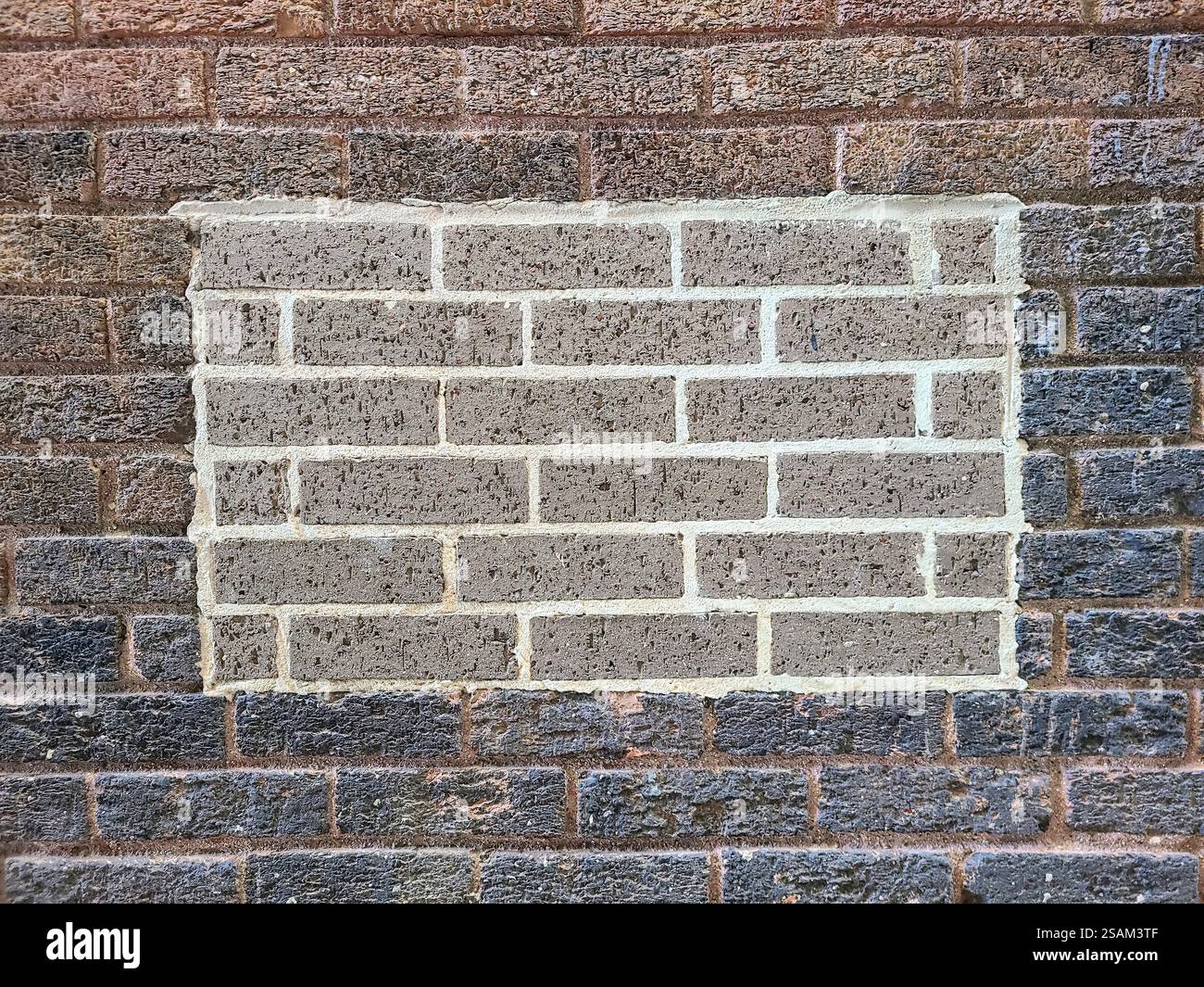 Détail de réparation de mur de briques urbaines avec perspective au niveau des yeux Banque D'Images