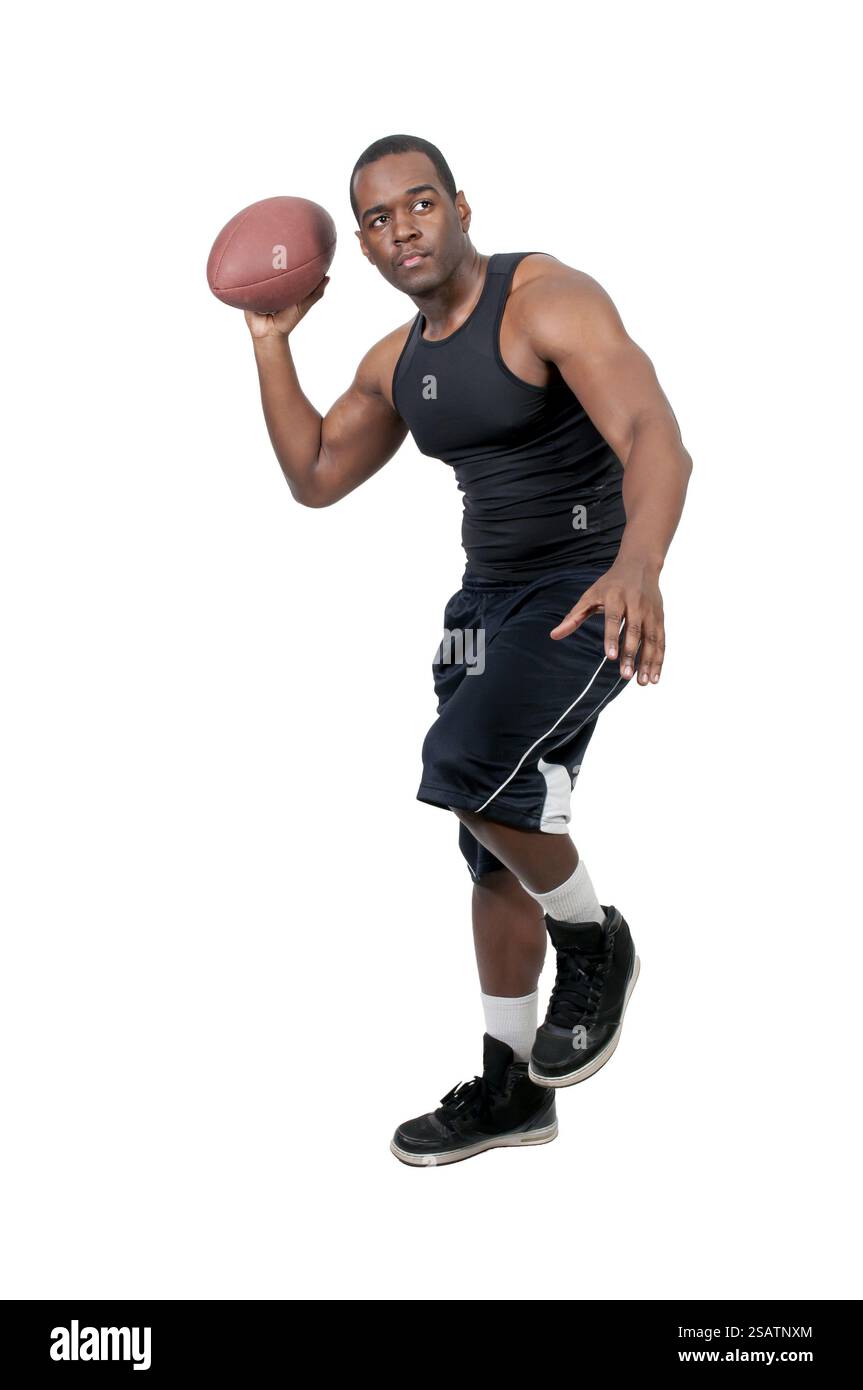 Homme noir afro-américain jouant au football Banque D'Images
