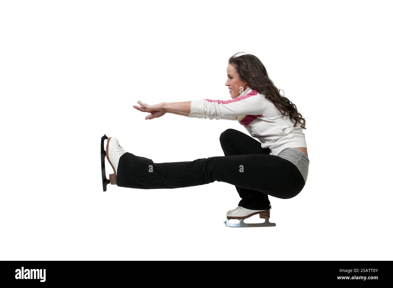 Belle jeune femme patineuse artistique sur patins à glace Banque D'Images