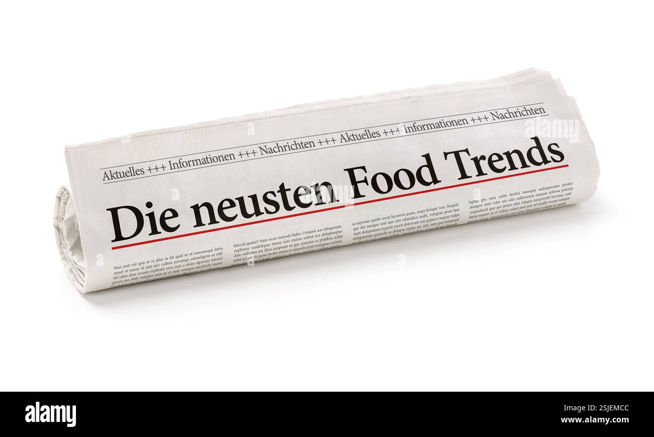 Rouleau de journal avec le titre les dernières tendances alimentaires Banque D'Images