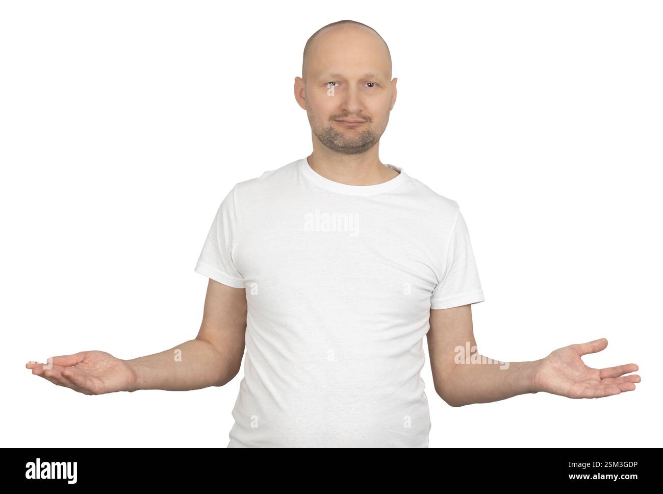 Un homme blanc du Caucase avec une barbe de 3 jours légère porte un t-shirt blanc et étend les deux mains dans un geste ouvert. Banque D'Images