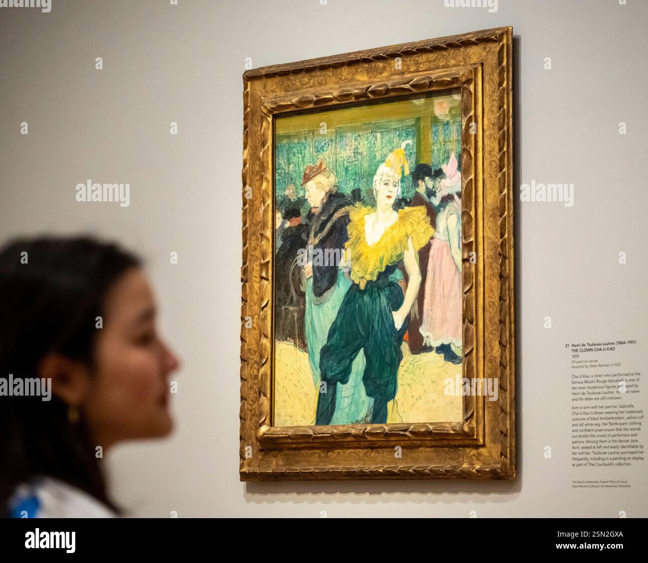 Londres, Royaume-Uni. 13 février 2025. Un collaborateur de « The Clown Cha-U-Kao », 1895, de Henri de Toulouse-Lautrec lors d’une avant-première de « Goya to Impressionism : Masterpieces from the Oskar Reinhart Collection » à la Galerie Courtauld. Des peintures impressionnistes et post-impressionnistes, dont des chefs-d’œuvre de Goya, Monet, Renoir, Van Gogh et Picasso, sont exposées dans la première exposition de la collection Oskar Reinhart à être mise en scène hors de Suisse. Le spectacle se déroule du 14 février au 26 mai 2025. Credit : Stephen Chung / Alamy Live News Banque D'Images