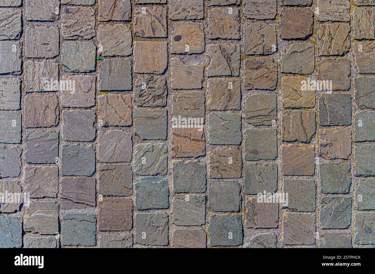 Texture de route pavée, fond abstrait de pavé pavé gros plan, vieille texture pavée en pierre de rue Banque D'Images