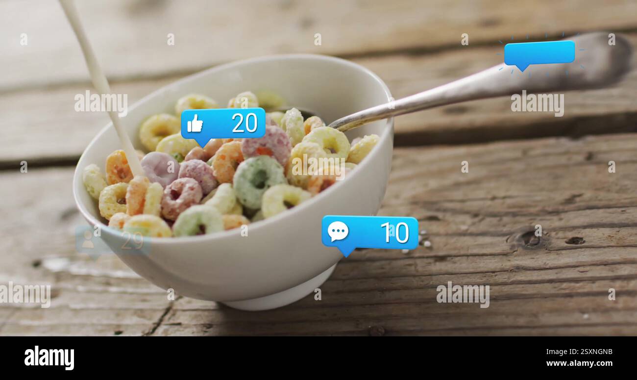 Verser le lait dans le bol de céréales, l'image des notifications des médias sociaux sur la table en bois Banque D'Images Verser le lait dans le bol de céréales, l'image des notifications des médias sociaux sur la table en bois Banque D'Images