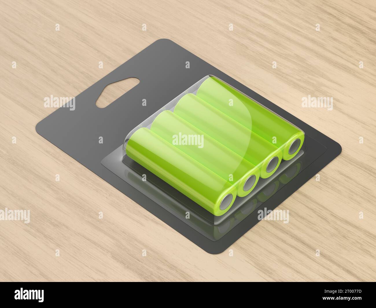 Blister de quatre piles AA sur bureau en bois Banque D'Images