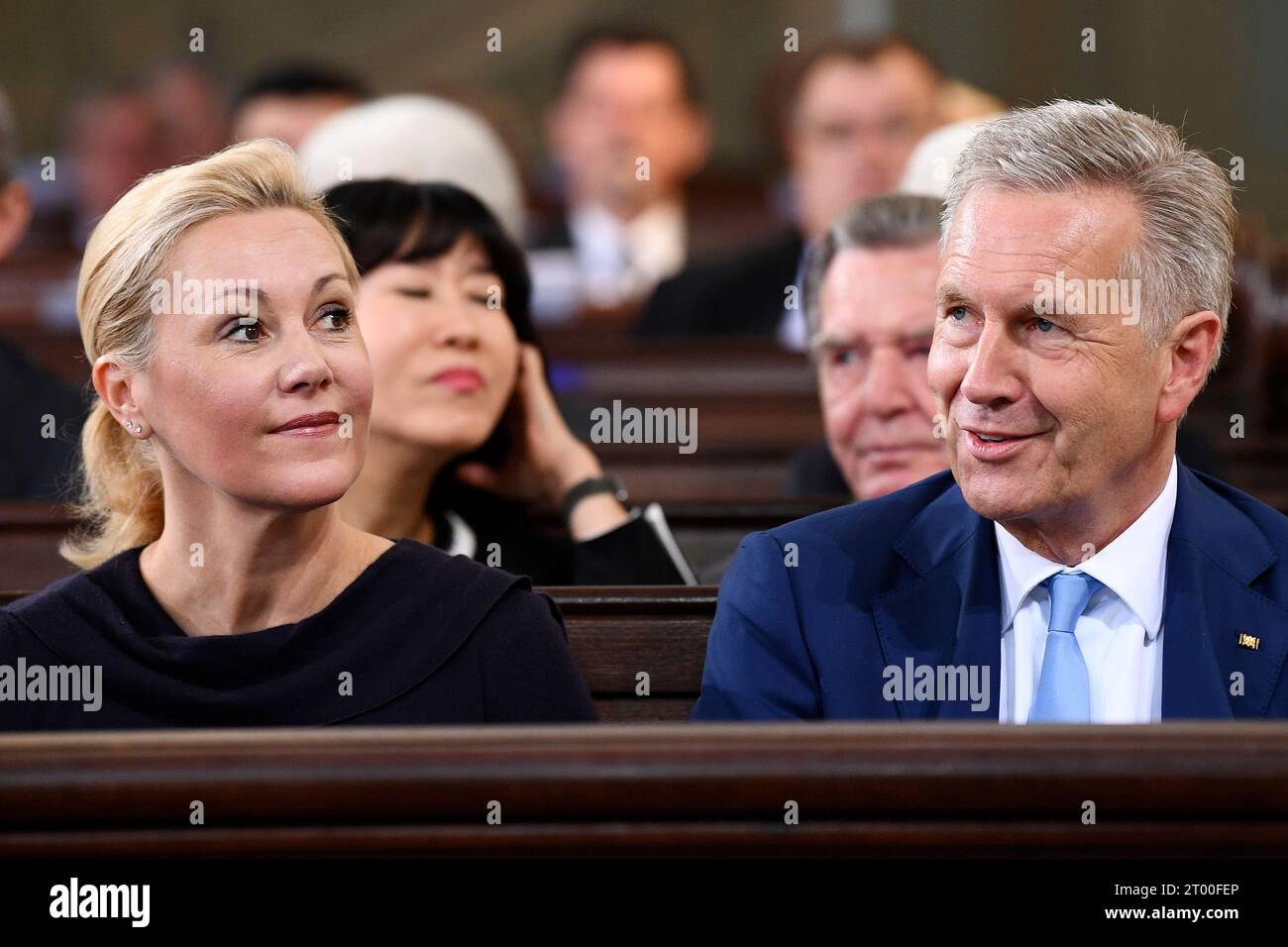 Former German President Christian Wulff and his wife Bettina attend an ecumenical service on occasion of the celebration of the German reunification in the St. Michaelis church in Hamburg, Germany, Tuesday, Oct.3, 2023. (AP Photo/Gregor Fischer, Pool) Banque D'Images