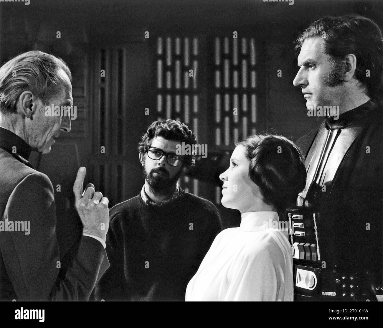 Star Wars : Episode IV - Un nouvel espoir Star Wars année : 1977 Etats-Unis réalisateur : George Lucas Peter Cushing, George Lucas, Carrie Fisher, David Prowse photo de tournage Banque D'Images