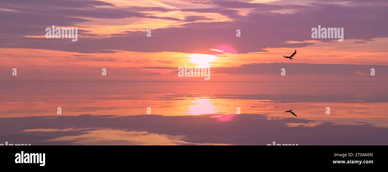 Dans une illustration informatique en 3D, un aigle s'élève contre un coucher de soleil radieux sur la mer, fusionnant la grandeur de la nature avec le charme de l'art numérique. Banque D'Images