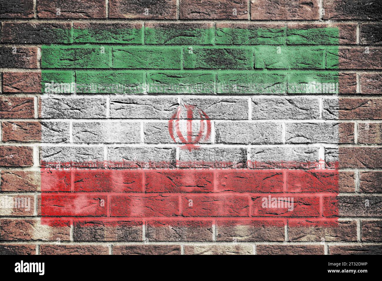Drapeau iranien peint sur fond de mur de brique Banque D'Images