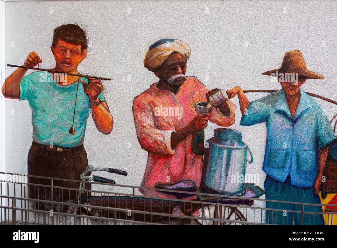 Peinture murale en couleur artistique représentant des gens dans les vieux métiers, Singapour. Banque D'Images