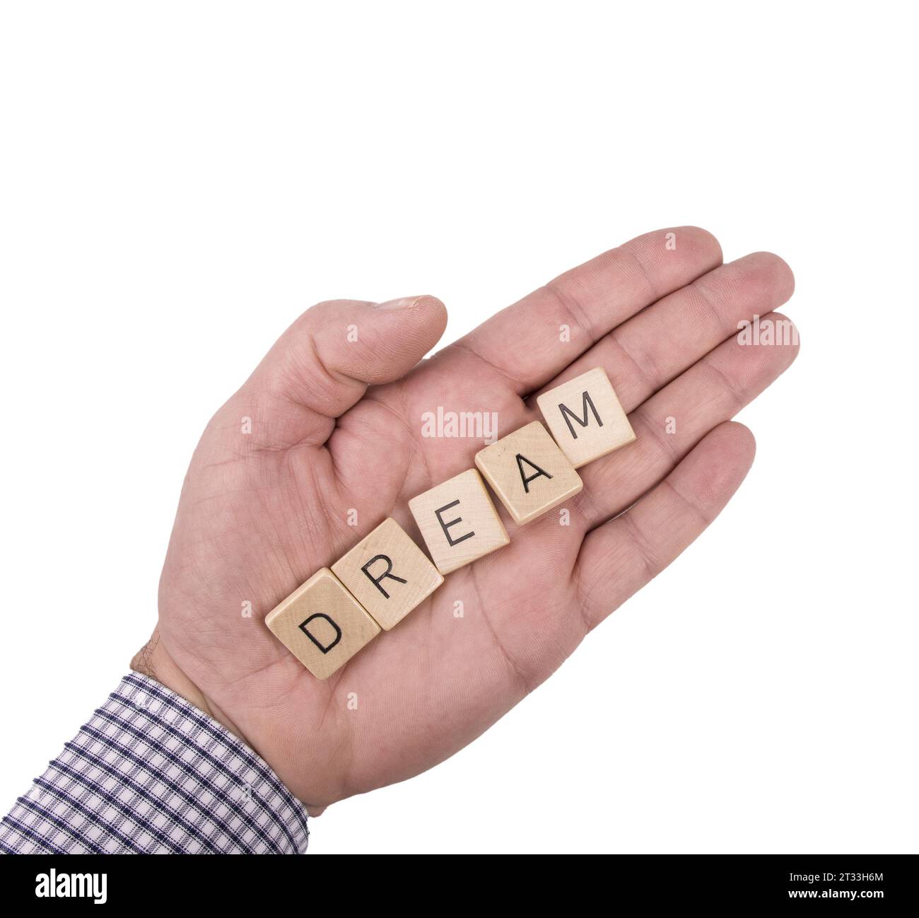 Le mot Dream sur la paume d'une main masculine sur un fond transparent Banque D'Images