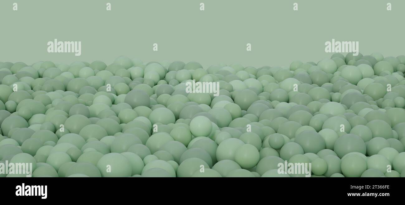 Sphères vert pastel sur fond coloré en studio Banque D'Images