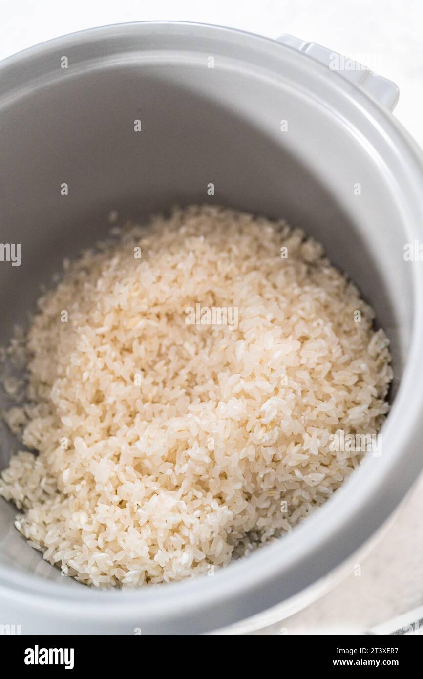 Cuisson du riz Banque D'Images Cuisson du riz Banque D'Images